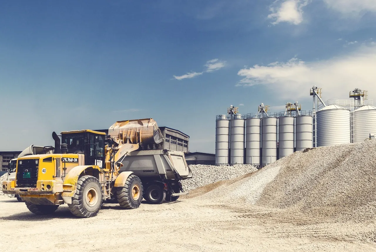 Front-end loader and gravel pile at a landscape supply yard